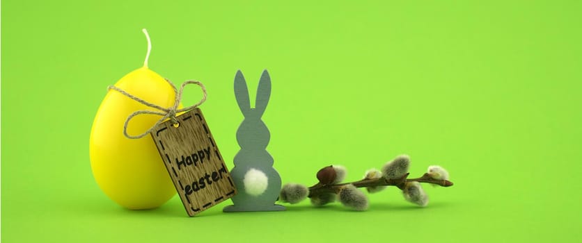 Minimalistic style Easter banner and wooden label with text "Happy Easter" on green background with free copy space for text