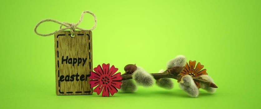 Minimalistic style Easter banner and wooden label with text "Happy Easter" on green background with free copy space for text