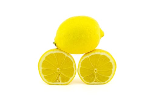 Whole and halved ripe lemon fruit isolated on white background