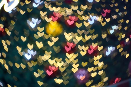 blur and bokeh heart shape love valentine night light at shopping mall