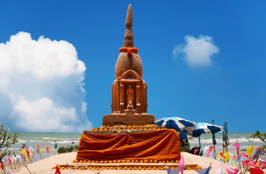 Lord buddha stand style sand pagoda in Songkran festival represents In order to take the sand scraps attached to the feet from the temple to return the temple in the shape of a sand pagoda