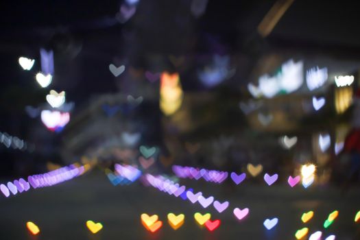 rainbow bokeh and blur heart shape love valentine colorful night light on floor