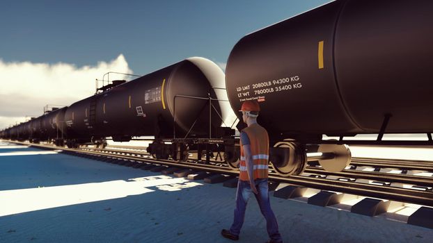 Oil worker walks past the railway with Rail tank cars driving on it.