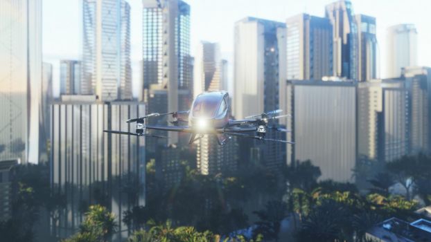 An unmanned passenger drone has flown in to pick up its passenger on a cloudy day. Unmanned air taxi.