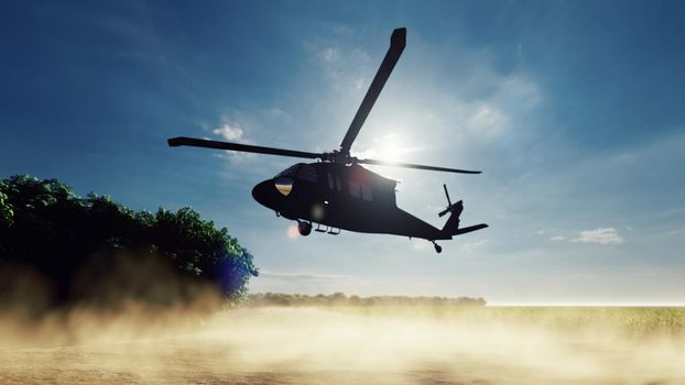 A Blackhawk military helicopter lands on a dusty road on a clear day in a deserted area.