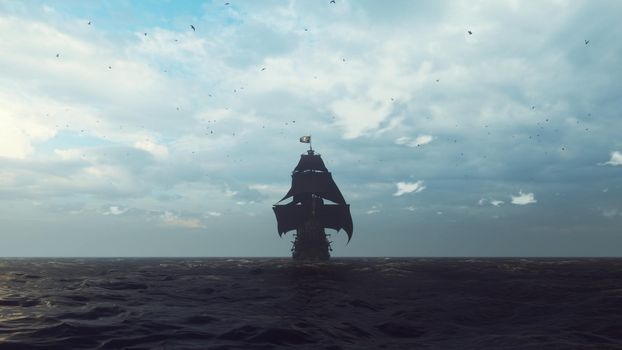 An old pirate ship with a flying pirate flag plows the ocean in the early foggy morning.