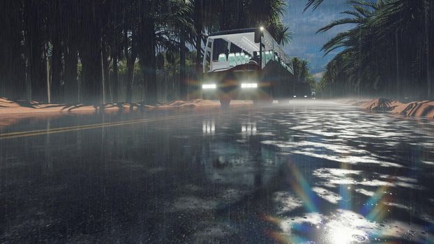 Tourist white buses travel on the highway in the tropics among the Sands, dunes and palm trees during a tropical downpour. The concept of tourism and travel.