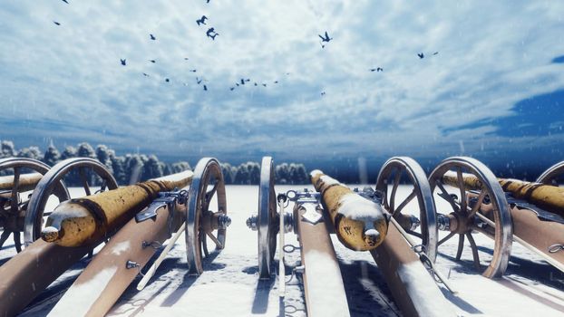 Medieval cannons in the winter field, in the snow on a cloudy day, before the battle. Falling snow, drifts and cannons ready for battle.