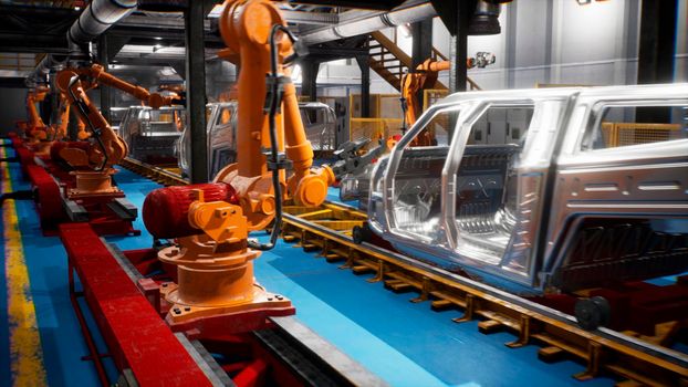 Car welding line of conveyor with frameworks of unfinished cars and robots welders. 