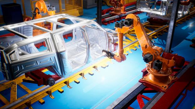 Car welding line of conveyor with frameworks of unfinished cars and robots welders.