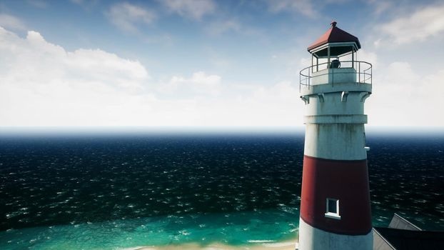 Lighthouse at sunrise on the background of the sea