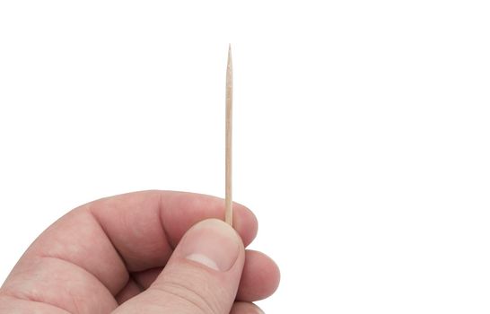 Hand holding toothpick isolated on white background.