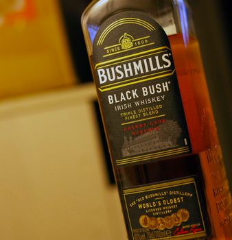 CHISINAU, MOLDOCA - FEBRUARY 19, 2021: Bottle of Bushmills Original Irish whiskey, product of Old Bushmills Distillery founded in 1608, today owned by Casa Cuervo. Concept photo