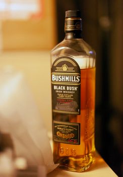 CHISINAU, MOLDOCA - FEBRUARY 19, 2021: Bottle of Bushmills Original Irish whiskey, product of Old Bushmills Distillery founded in 1608, today owned by Casa Cuervo. Concept photo