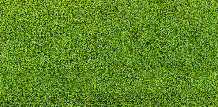 Green grass texture background. Artificial green grass. Top view of bright grass background. Idea concept used for making green backdrop, lawn for a training football pitch, Grass Golf Courses green lawn pattern textured background.