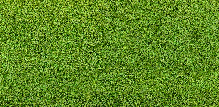 Green grass texture background. Artificial green grass. Top view of bright grass background. Idea concept used for making green backdrop, lawn for a training football pitch, Grass Golf Courses green lawn pattern textured background.