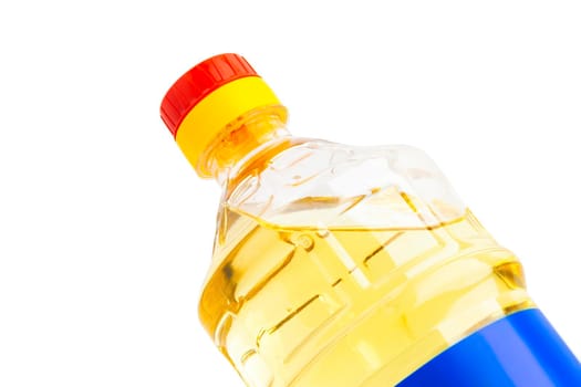 Oil in plastic bottle isolated on white background. With clipping path