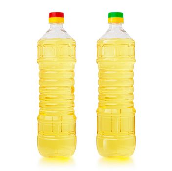 Oil in plastic bottles. Two bottles isolated on white background. With clipping path