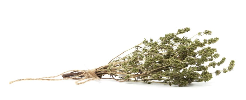 Dry thyme pile and plants with stalks isolated on white background