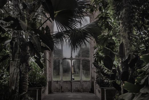 London, UK - Apr 9, 2019 : Beautiful exit door of Palm House at Kew Gardens (Royal Botanic Gardens).