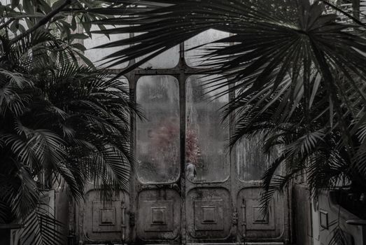 London, UK - Apr 9, 2019 : Beautiful exit door of Palm House at Kew Gardens (Royal Botanic Gardens).