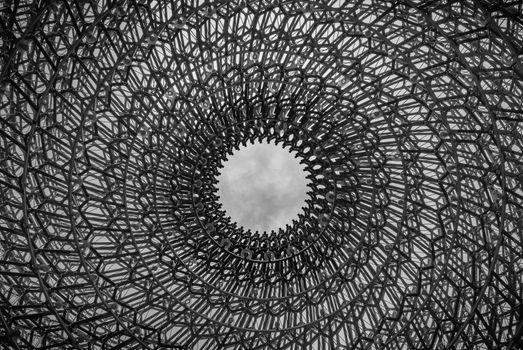 London, UK - Apr 9, 2019 : Detail on the center of the intricate structure under a clear sky, It is called "The Hive" Designed by Artist Wolfgang Buttress.