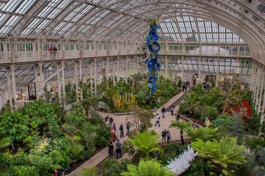 London, UK - Apr 9, 2019 : Palm trees in Palm house (greenhouse) at Kew Royal Botanic Gardens, Richmond.