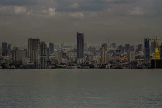 Bangkok, Thailand - Oct 05, 2019 : Beautiful view of city at afternoon Look through the roof top infinity pool in Bangkok.