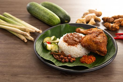 Nasi Kukus is usually comprising freshly steamed rice, crispy fried chicken, sambal belacan, acar and a curry gravy