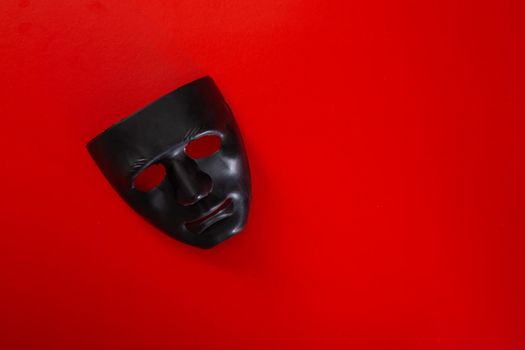 carnival white mask on red background