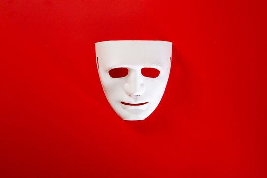 carnival white mask on red background