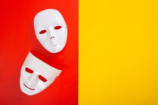 carnival white mask on red and yellow background