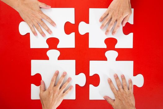 business people hand assembling jigsaw puzzle and represent team support-business concept