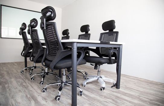 White office interior with furniture and daylight