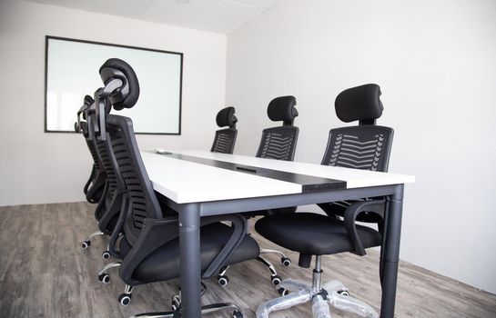 White office interior with furniture and daylight