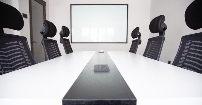 White office interior with furniture and daylight