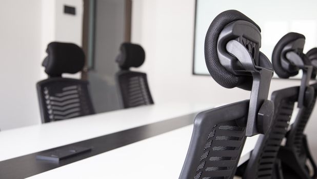 White office interior with furniture and daylight