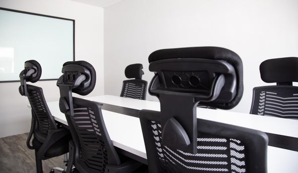 White office interior with furniture and daylight