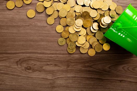 Coins on a wooden table. The texture of the coins as a background of wealth and profit. flat lay