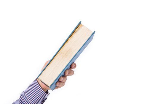 Male hand holding a book isolated on a white background,