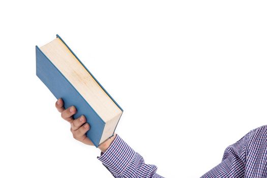 Male hand holding a book isolated on a white background,