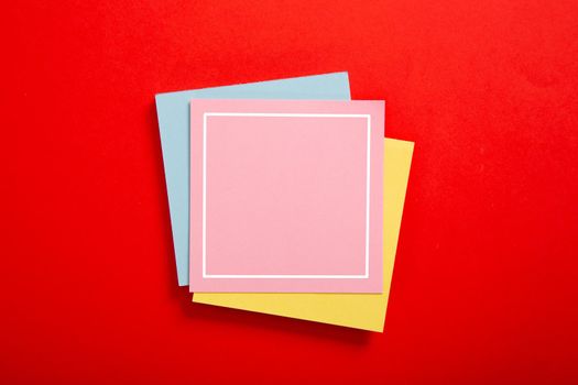Blank sticky note on red background