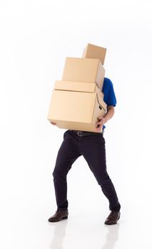 young Asian delivery man in blue uniform, carrry cardboard box in hands isolated on white background. Delivery concept