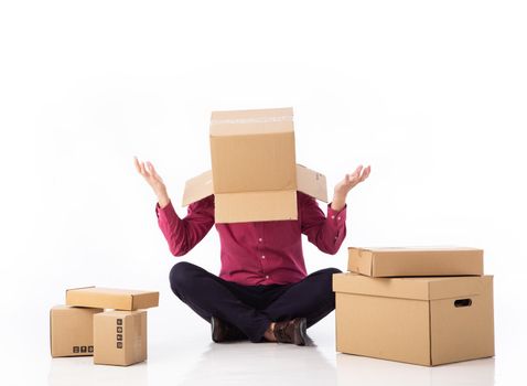 man cover his head with cardboard and confused on courier parcels isolated on white background.