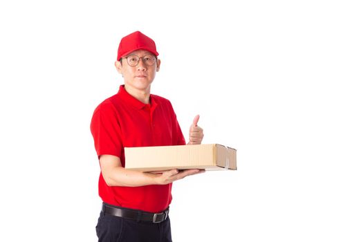 young Asian delivery man in red uniform, carry cardboard box in hands isolated on white background. Delivery Concept