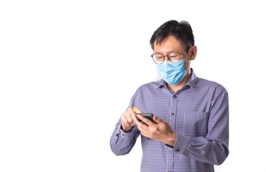Asian men wear medical masks to prevent the spread of the corona virus are using the phone. Medical concept