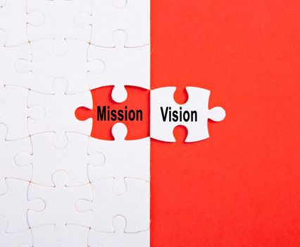 VISION and MISSION using jigsaw puzzles. Selective focus.