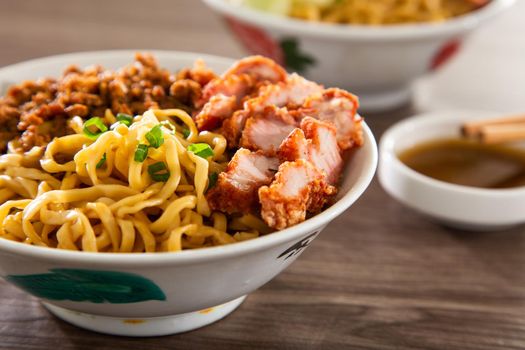 A Kolo Mee is a Sarawak Malaysian dish of dry noodles tossed in a savoury pork and shallot mixture, topped off with fragrant fried onions.