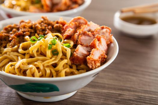 A Kolo Mee is a Sarawak Malaysian dish of dry noodles tossed in a savoury pork and shallot mixture, topped off with fragrant fried onions.