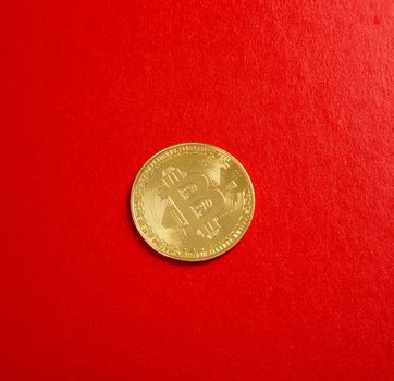 close up on bitcoin on red background